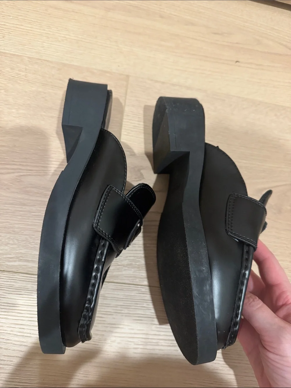Prada women’s Black Leather Slide Loafers with Triangle Logo